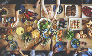 A large table of different food options. Representing how nutrition therapy in Raleigh, NC can help you build a better relationship with food. Call today to get started!