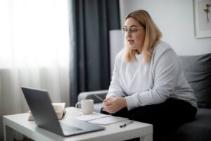 A woman talking to her dietitian on the computer while sitting down. At our Raleigh, NC practice, we can hold sessions in-person & online! Reach out to us today to get started with a dietitian. 