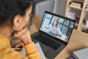 An individual talking to their online therapist through Telehealth. To get started with a dietitian in Raleigh, NC, reach out to us today. We offer nutritional counseling & medical nutrition therapy. 